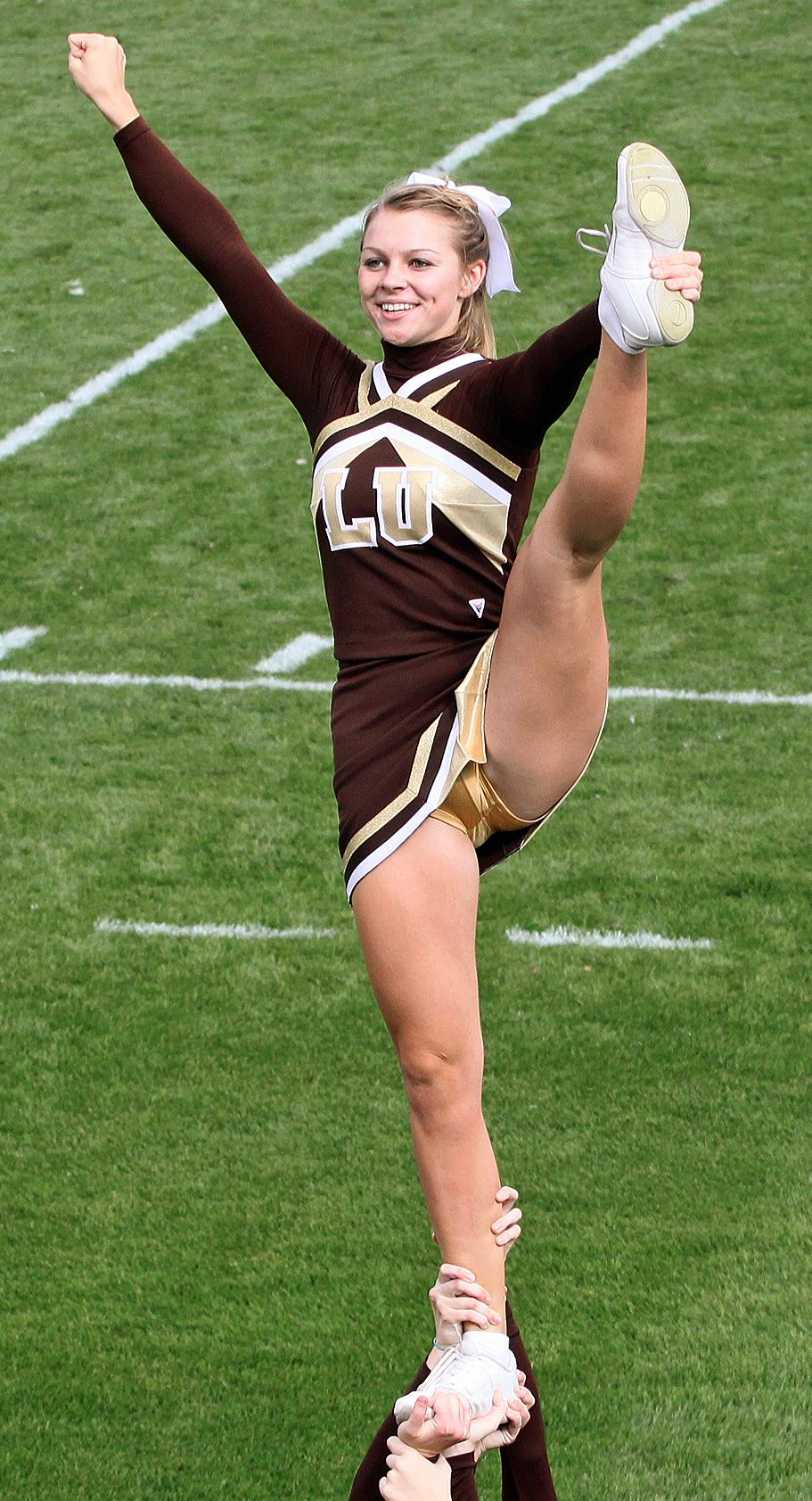 Blonde Cheerleader showing Upskirt in Short Dress, White Socks and Golden Knickers